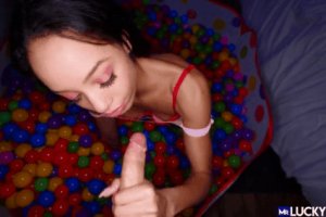 Playing with his big dick in a ball pit